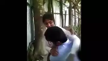 Hidden web camera catches a lascivious college cutie giving a kiss and having outdoor fun