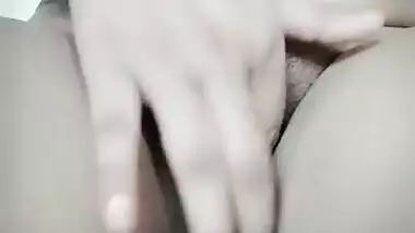 Pretty brunette spreads legs wide to XXX finger her wet Desi cunt