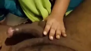 Modest Desi wife begins sex with husband by giving him XXX handjob